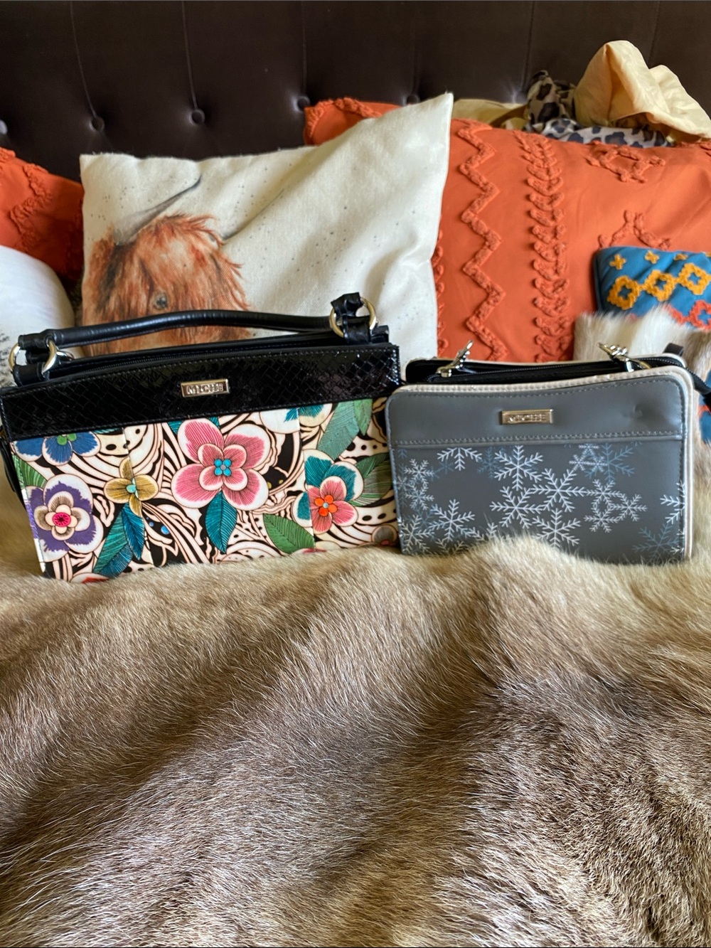 Two Miche bags, one with a floral design and one with snow flakes